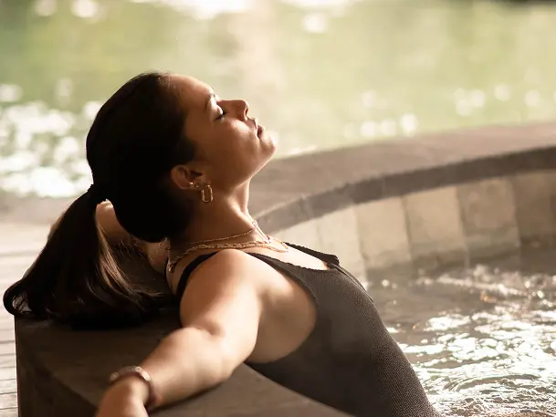 A woman relaxing in the pool.