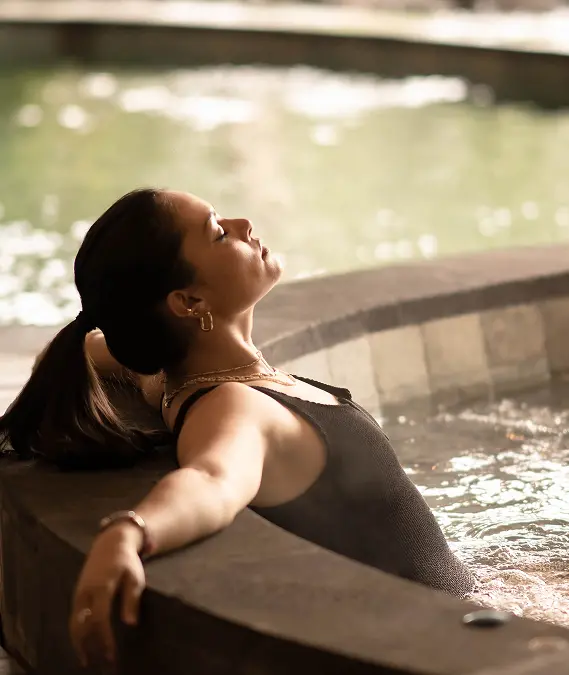 A woman relaxing in the pool.