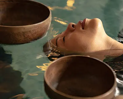 A woman’s head relax above the water