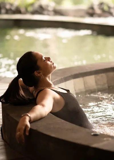 A woman relaxing in the pool.