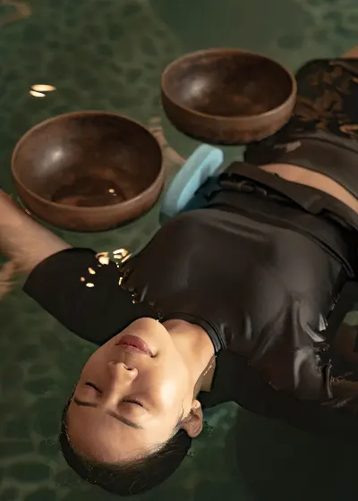 woman floating in the pool during a spa treatment.
