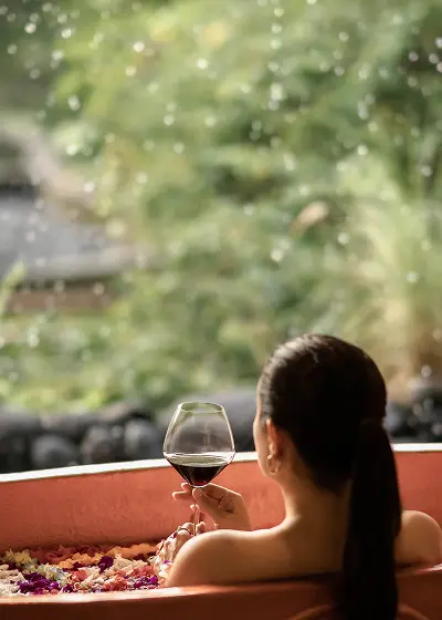 A woman with glass of wine
