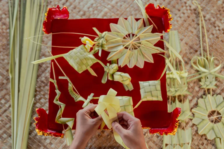 Making Balinese crafts from coconut palm leaves.