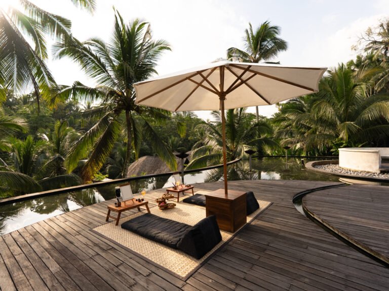 Two relaxing spots by the pool when sunset