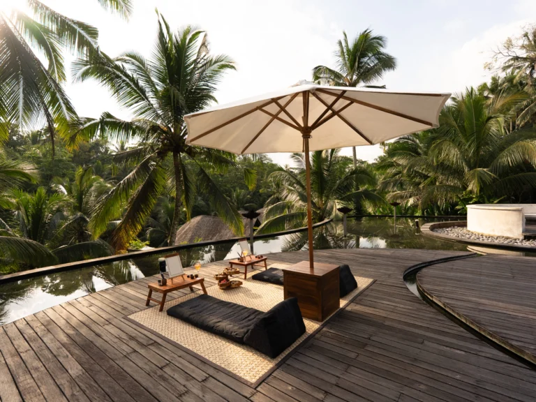 Two relaxing spots by the pool when sunset