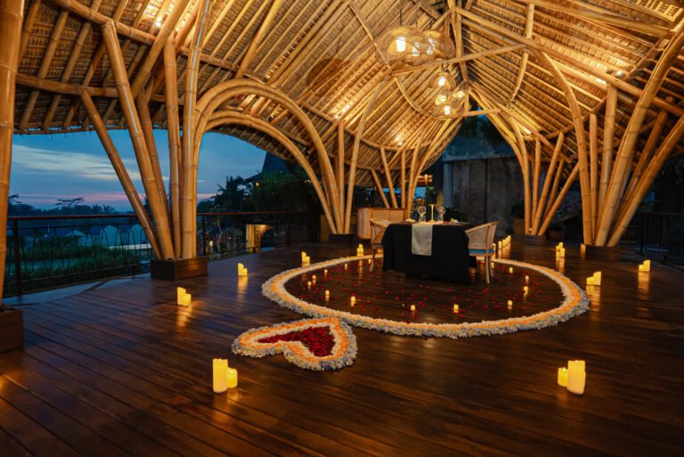 Romantic dinner settings with heart-shaped flower decorations.