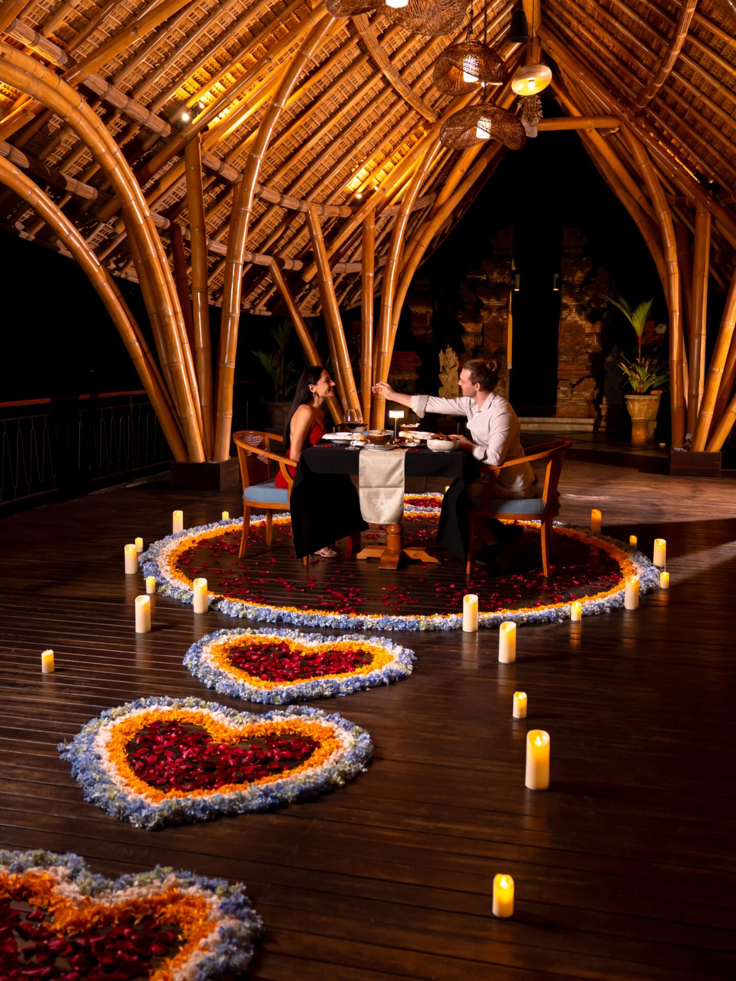 A couple enjoying a romantic dinner.