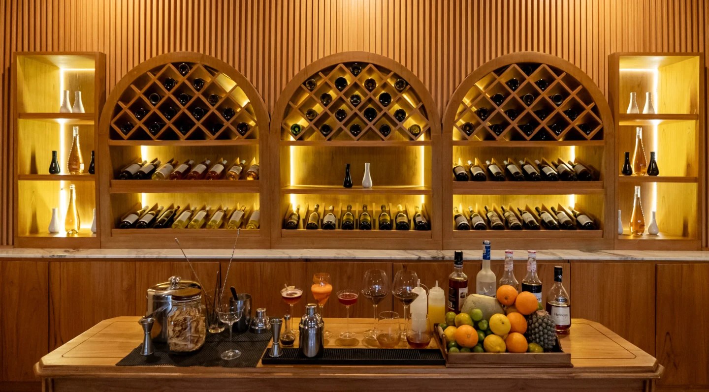 Some fruit and bottles of alcohol