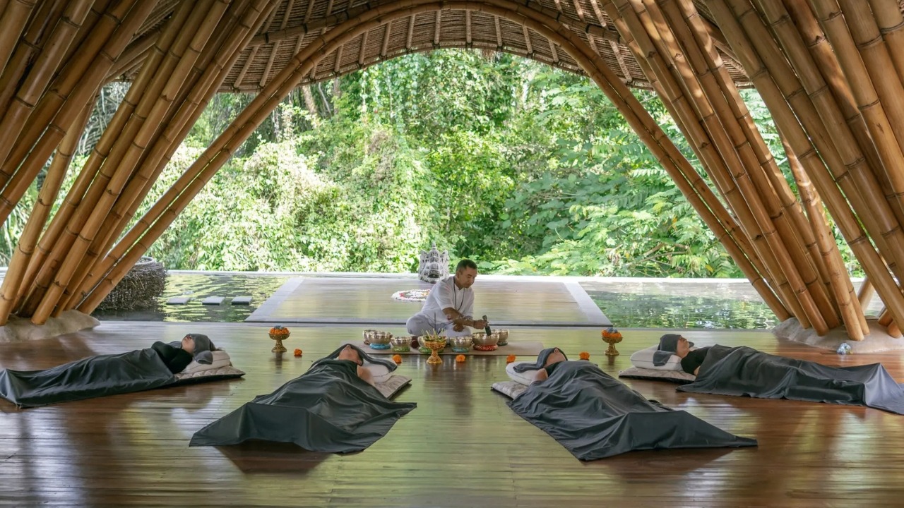 Sound healing session in a bamboo wellness space in Ubud