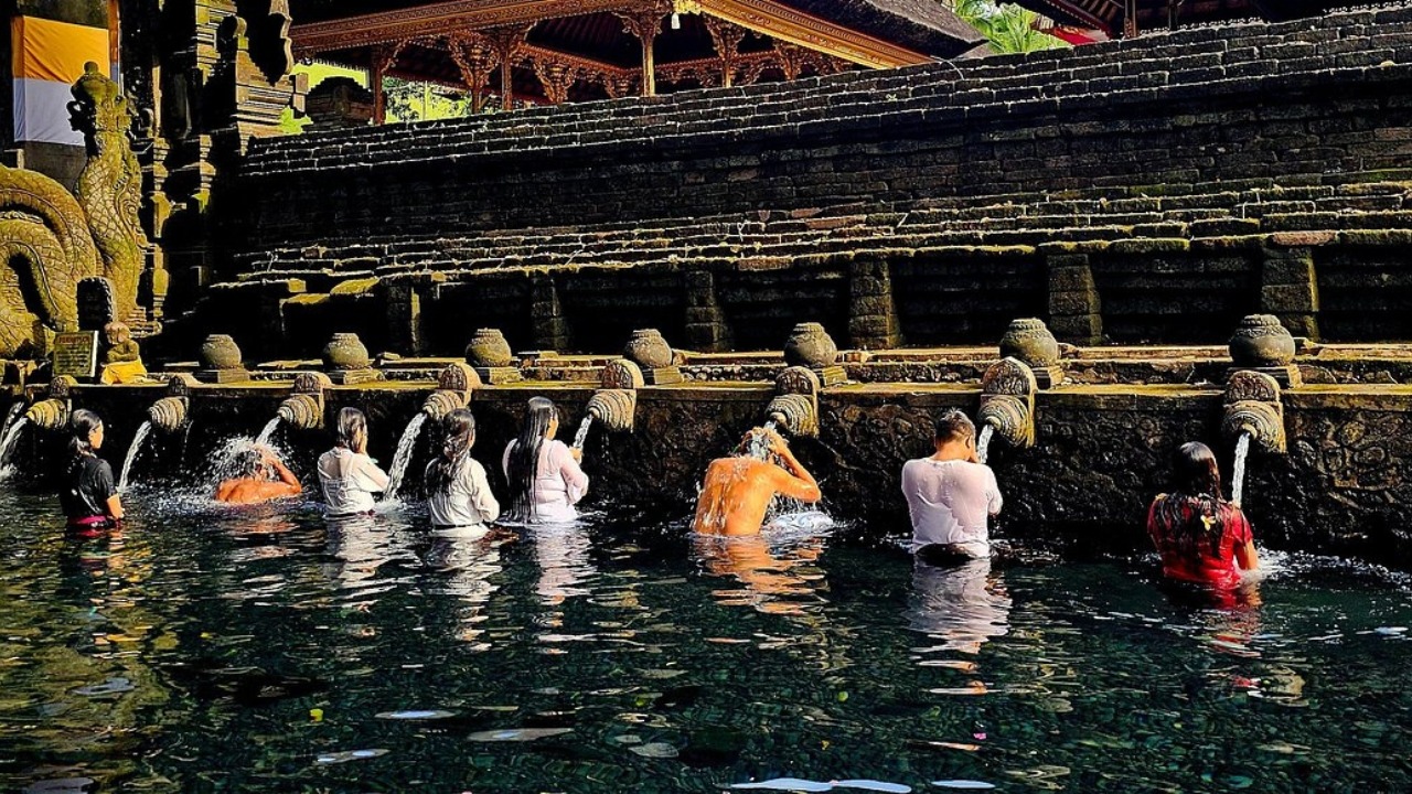 Balinese water purification ceremony at a sacred temple